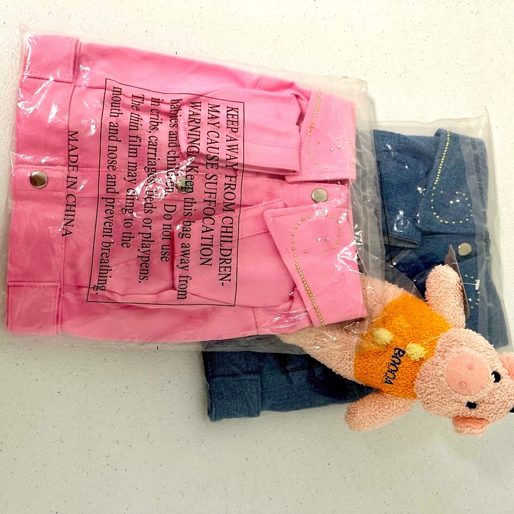 Dog or cat. Studded denim jacket blue or pink size small. Take them both for $22